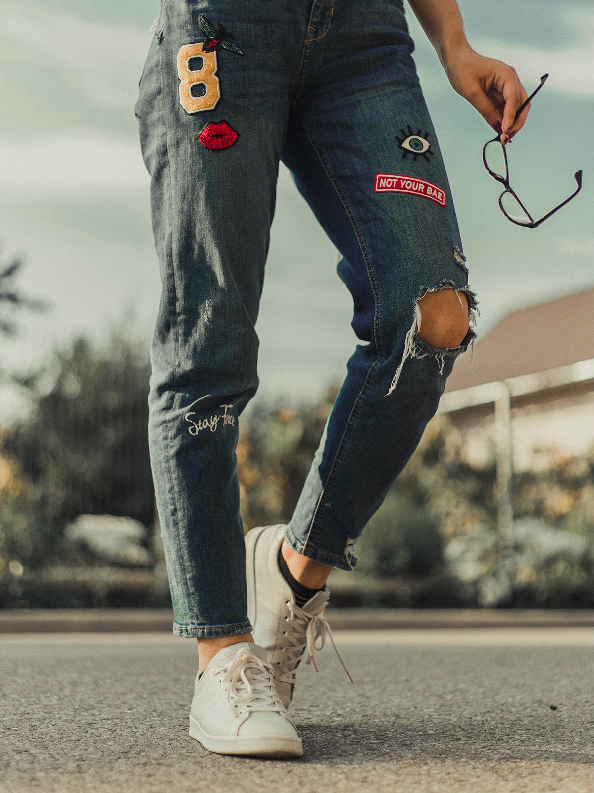 111F patched jeans with fancy badges